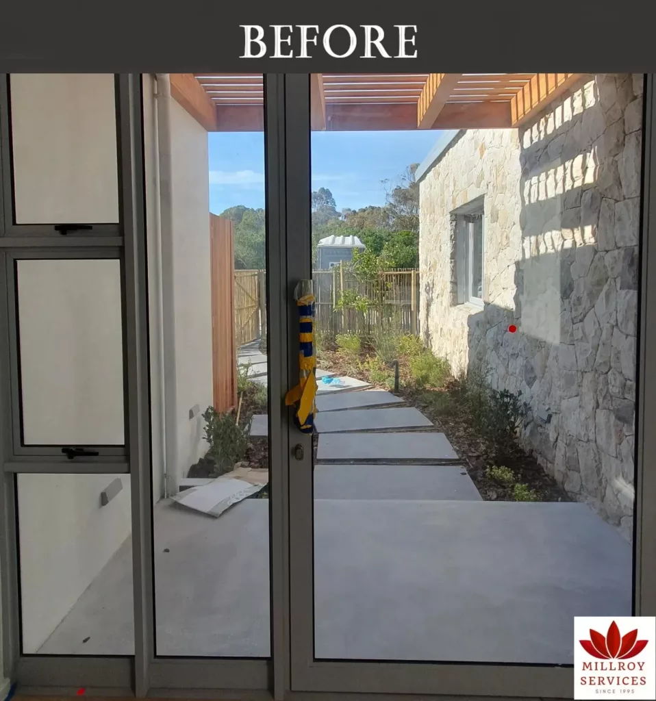 Clear glass door and windows in a residential home before frosted vinyl application.