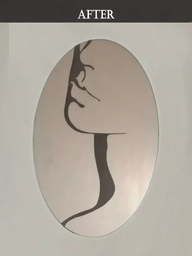 Oval mirror with engraved minimalist female face line art design
